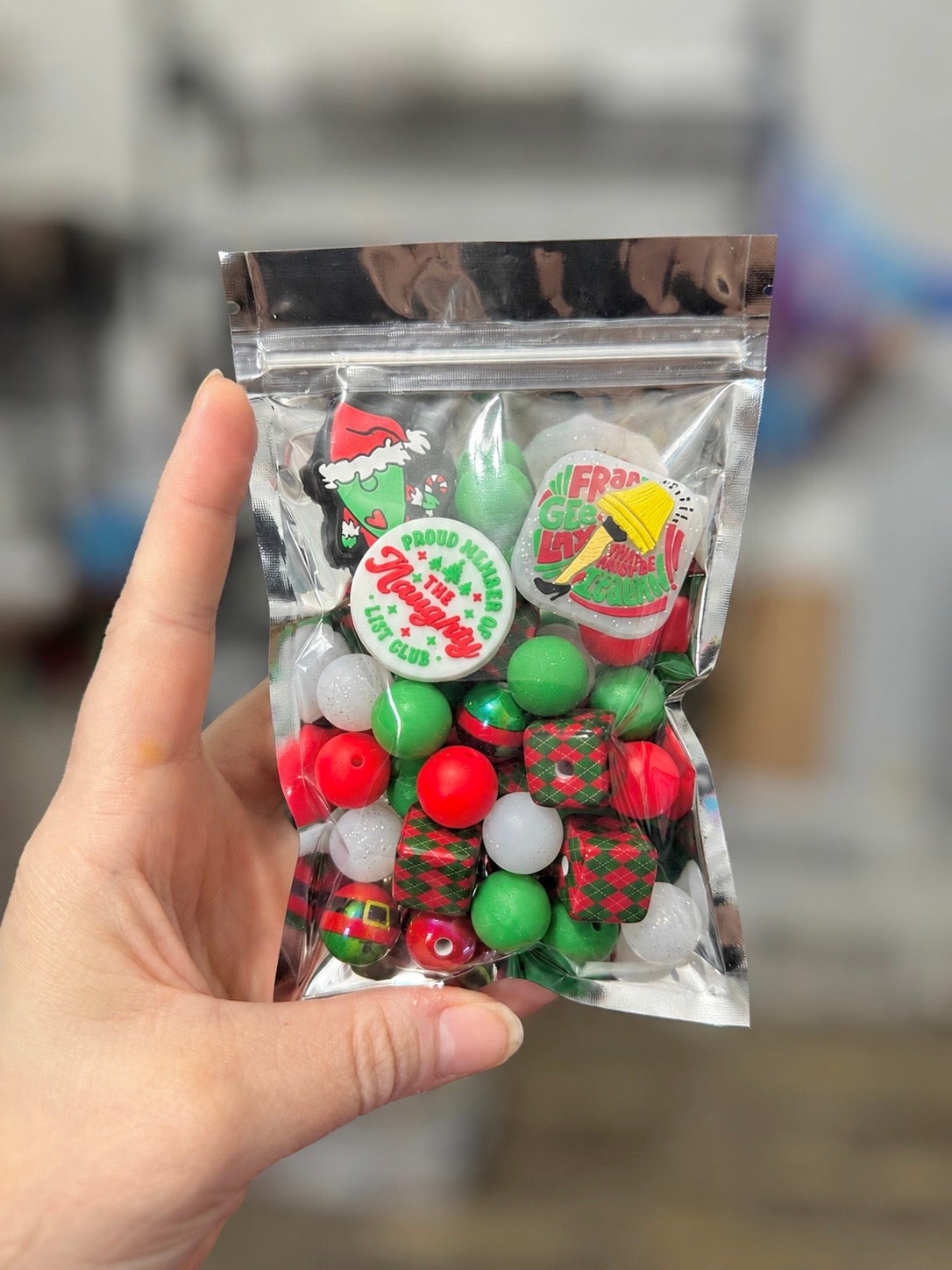 30+ piece red and green Christmas acrylic and silicone bead mix with three holiday silicone focals