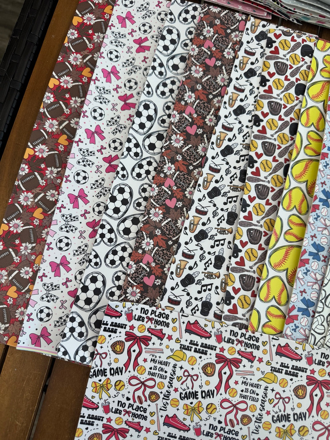 Faux leather sport bundle with assorted sports-themed printed sheets