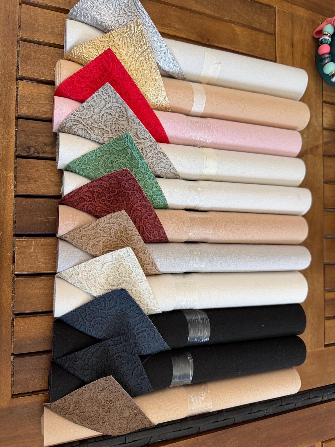 Faux leather lace rolls in assorted metallic, neutral and jewel colors, sold individually