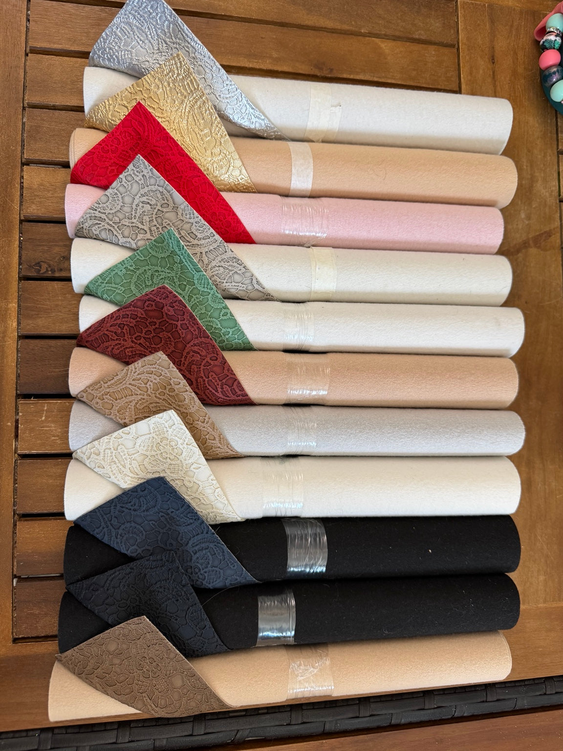 Faux leather lace rolls in assorted metallic, neutral and jewel colors, sold individually