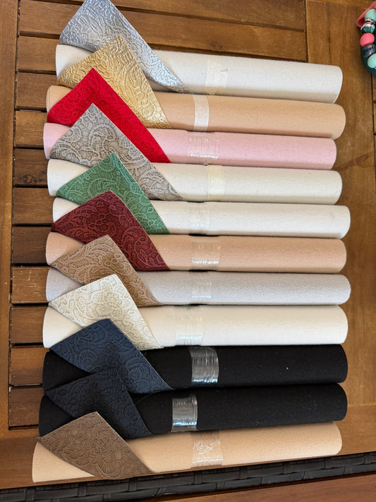 Faux leather lace rolls in assorted metallic, neutral and jewel colors, sold individually