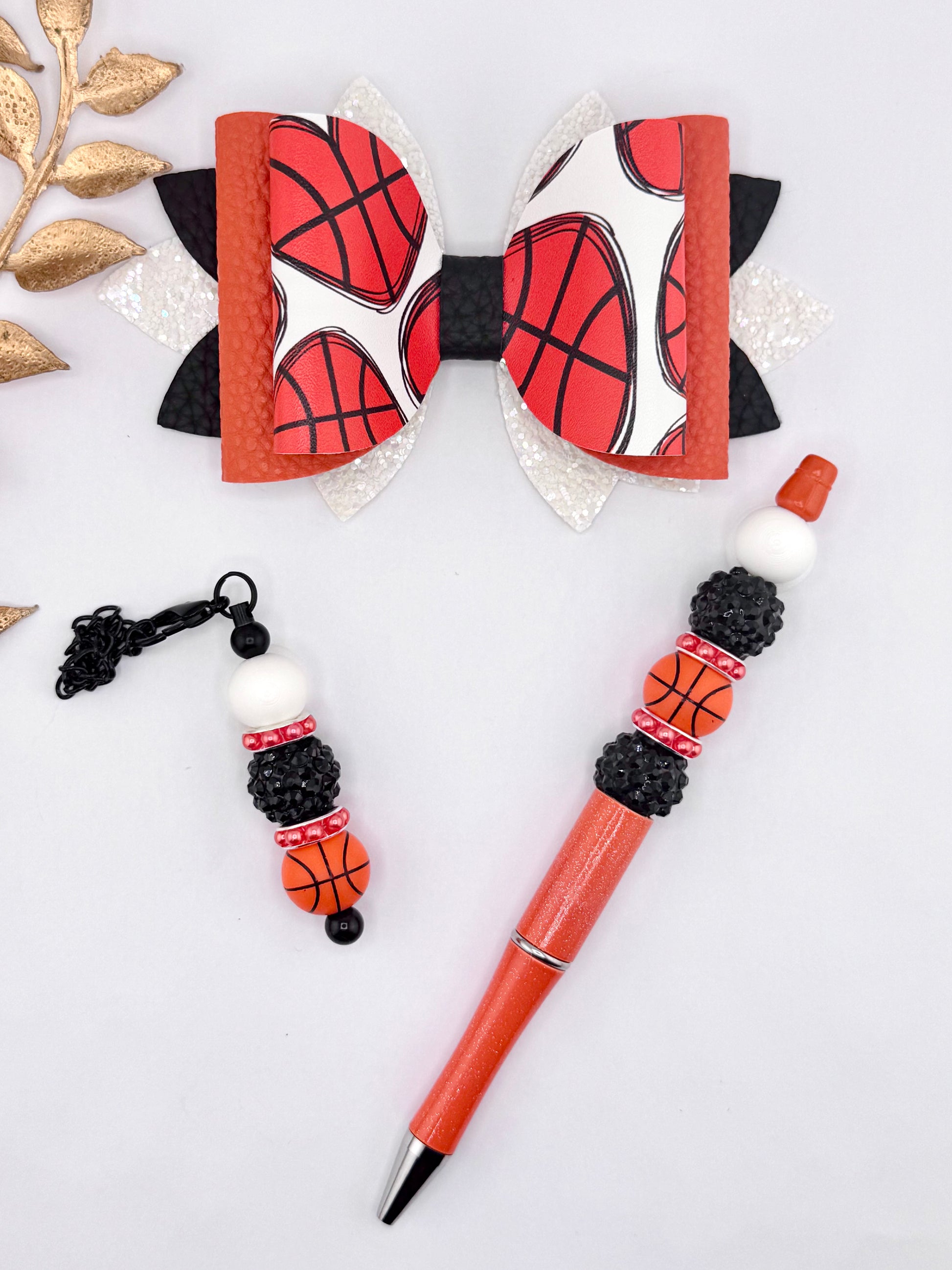 Basketball faux leather bow set with matching beaded pen and keychain charm featuring orange basketball print, black, and white glitter layers.