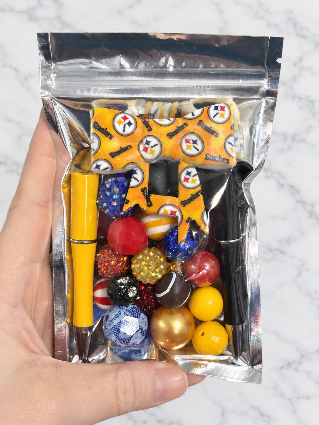 Golden Kickoff – First Dibs Curated Pen + Bow Bead Bag