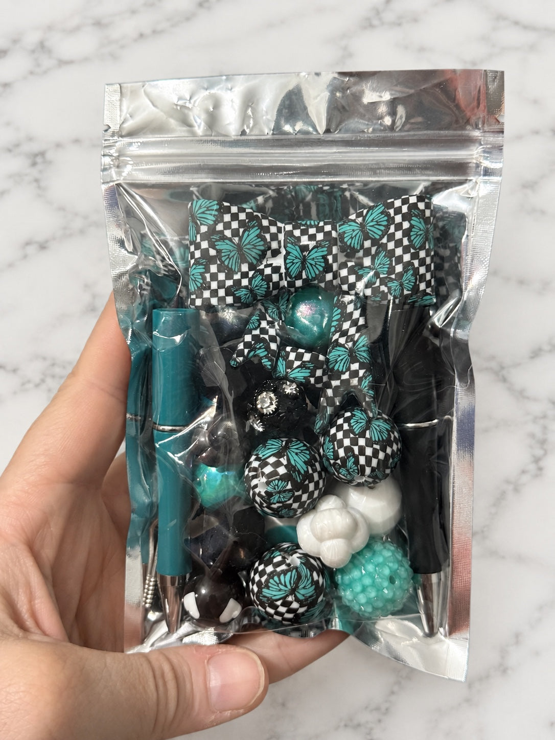 Teal Monarch curated pen and bow bead bag