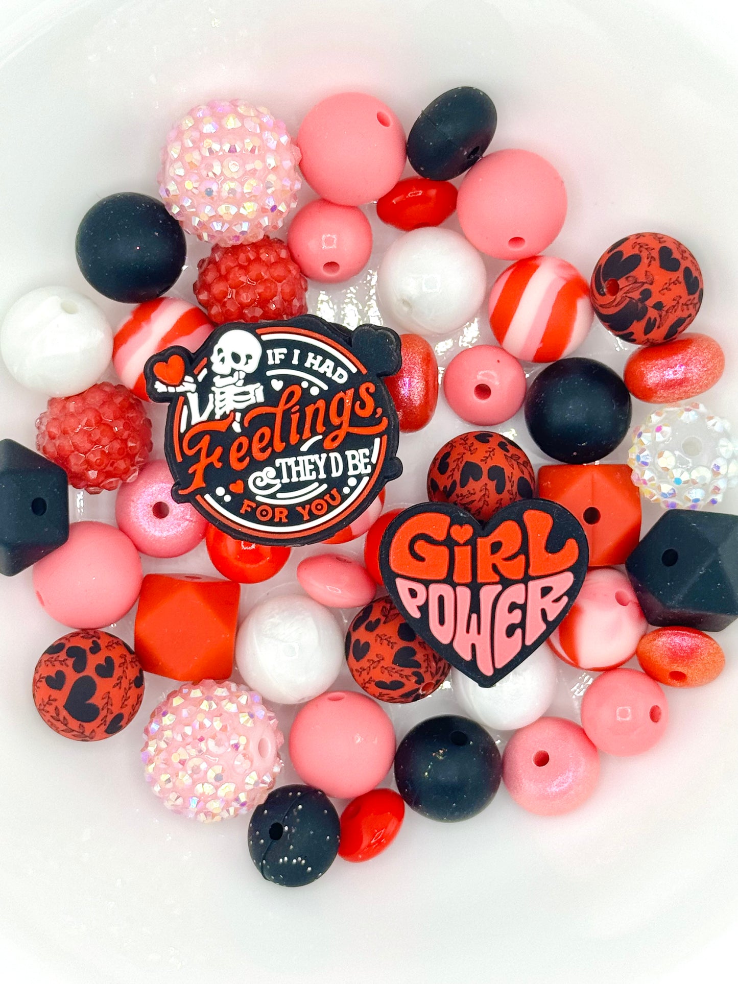 Pink and red silicone bead mix featuring girl power and sassy quote focal beads, great for empowering keychains and wristlets