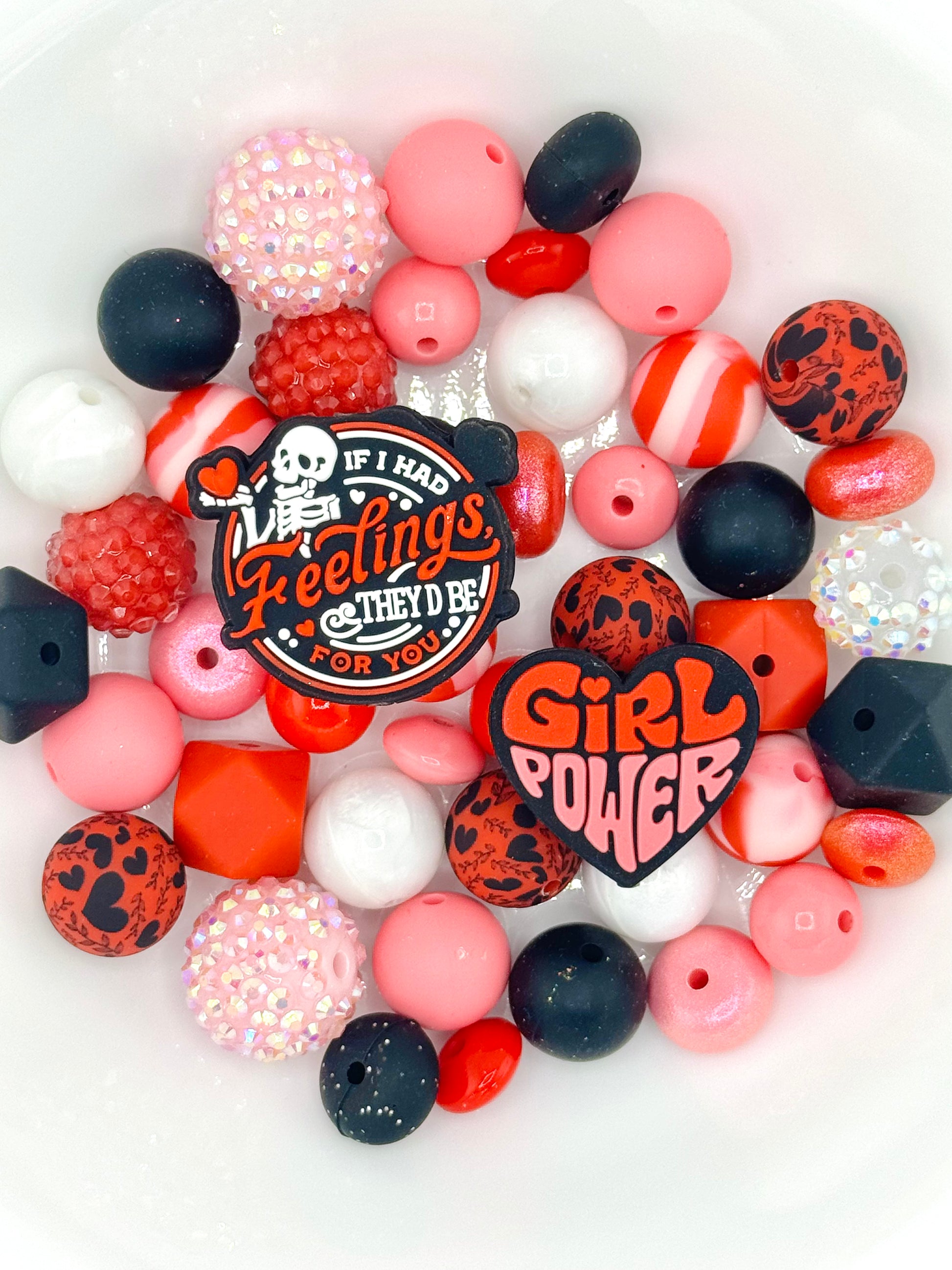 Pink and red silicone bead mix featuring girl power and sassy quote focal beads, great for empowering keychains and wristlets