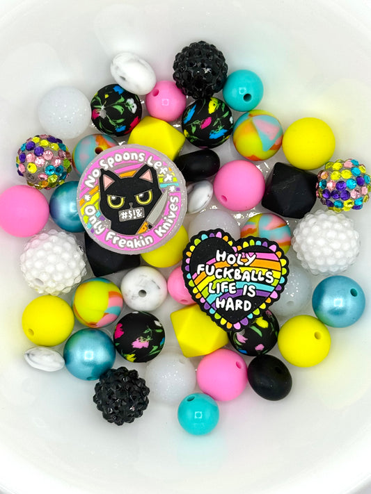 Bright silicone bead mix with rainbow quote focal beads and profanity sayings, ideal for edgy keychains and statement accessories