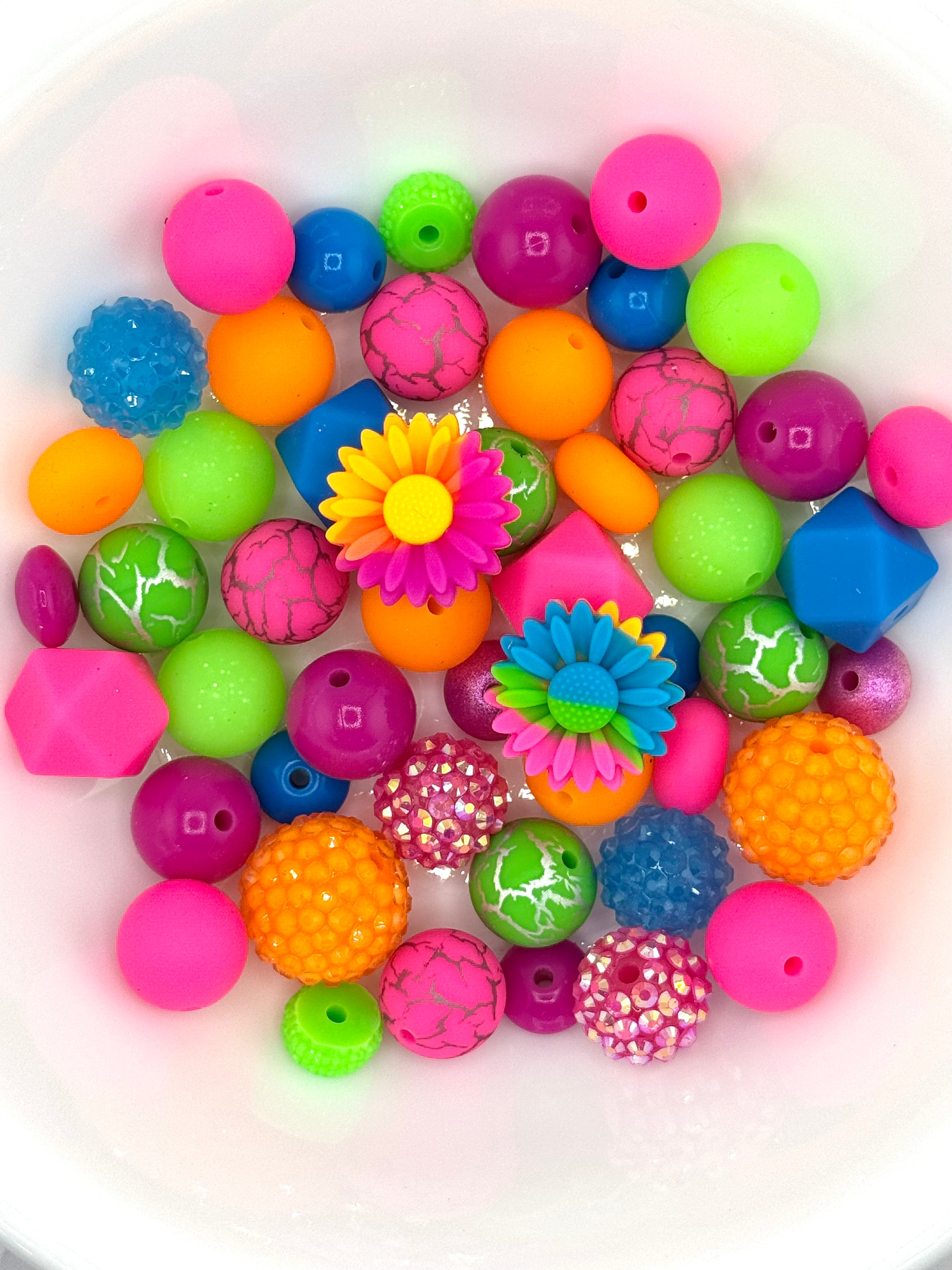 Bright neon silicone bead mix with colorful daisy flower focal beads for fun summer wristlets and DIY keychains