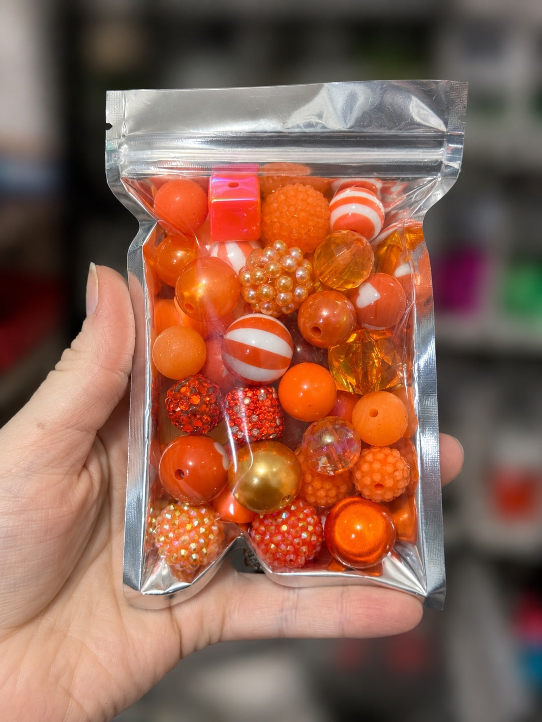 Orange 35-piece color-themed bead bag with assorted acrylic and silicone beads in mixed shapes and sizes