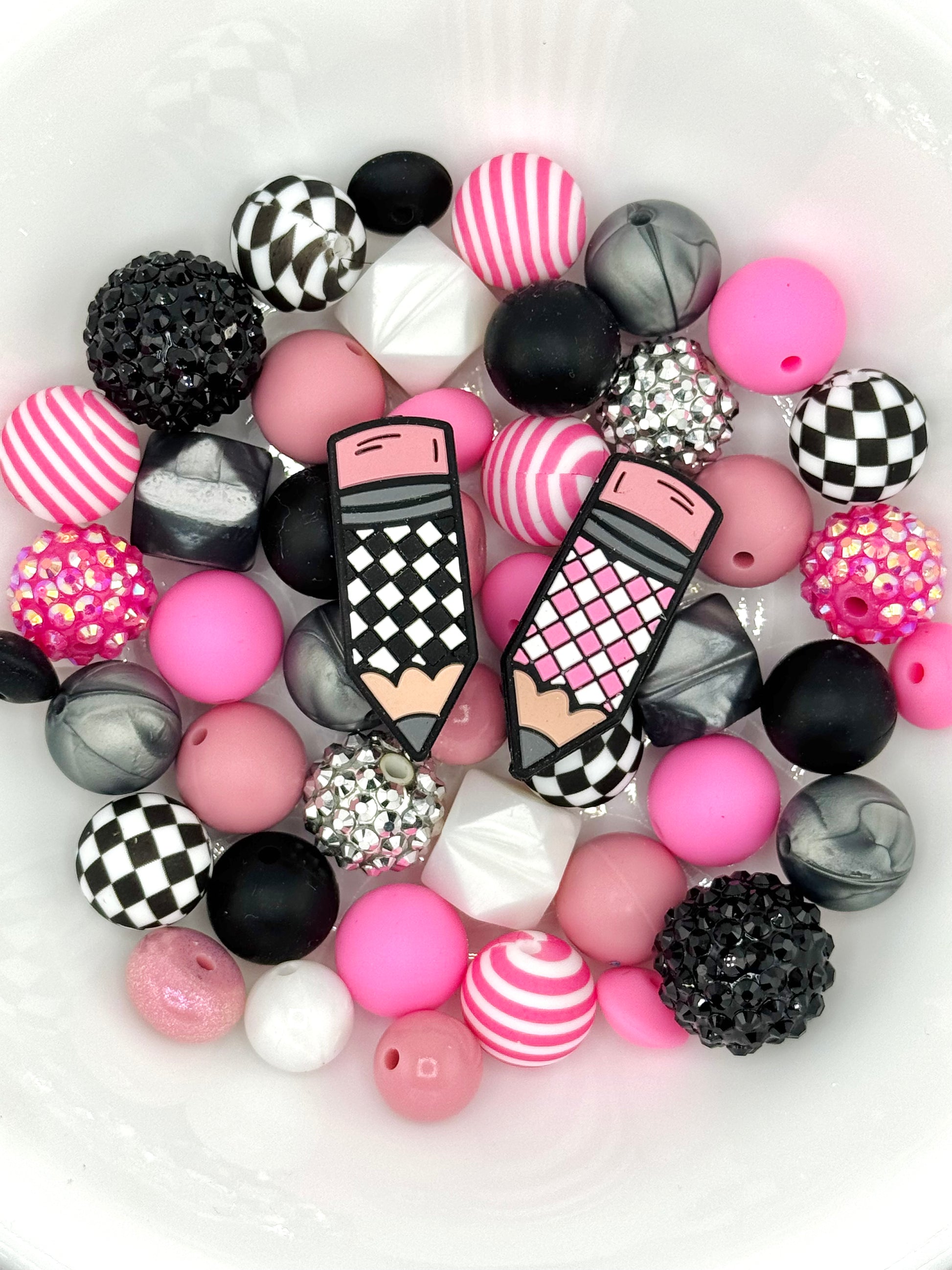 Pink and black silicone bead mix with checker accents and pencil focal beads, perfect for teacher keychains, wristlets, and DIY accessories