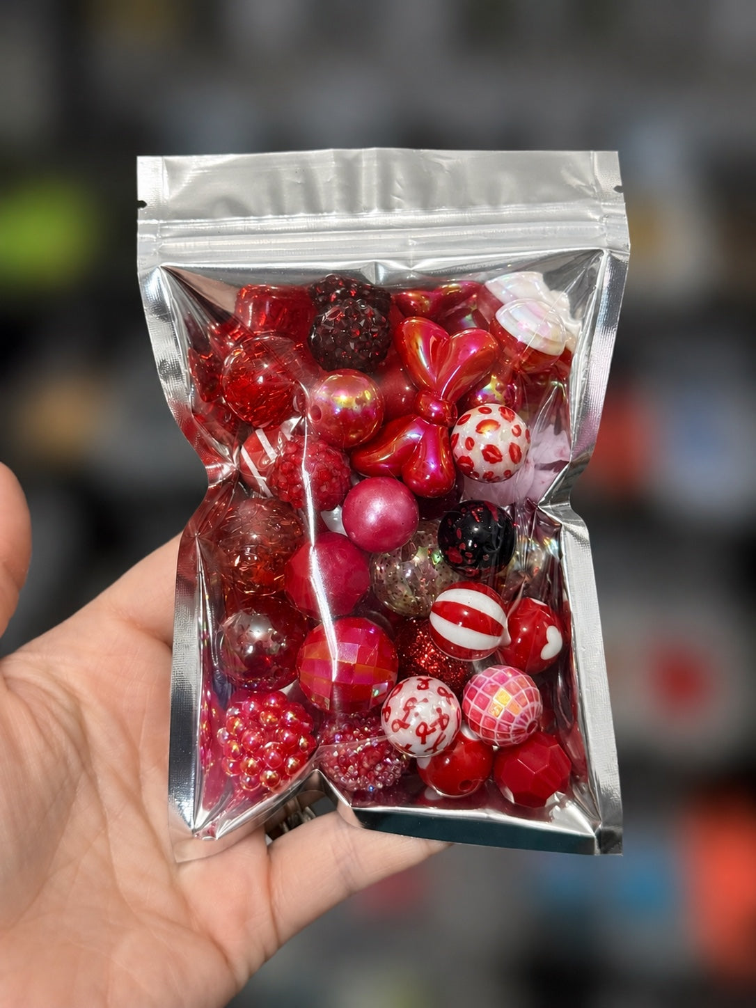 Red 35-piece color-themed bead bag with assorted acrylic and silicone beads in mixed shapes and sizes
