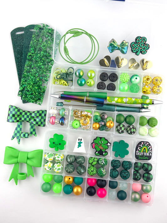 122 piece St Patrick’s Day craft starter kit featuring green silicone beads, clover charms, bows, beadable pens, keychain hardware, glitter faux leather, and lucky themed accessories for DIY wristlets, pens, and keychains