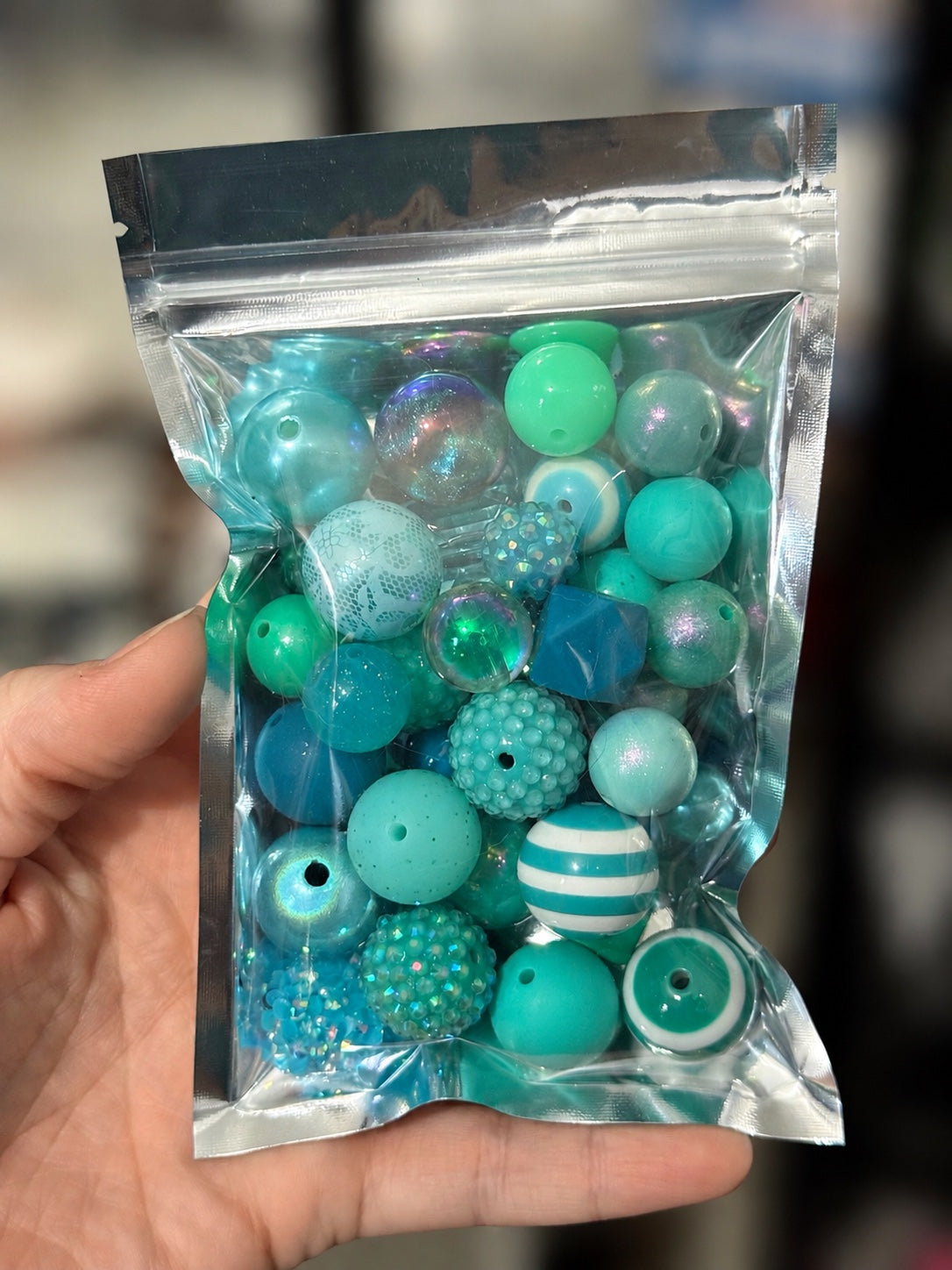 Teal 35-piece color-themed bead bag with assorted acrylic and silicone beads in mixed shapes and sizes